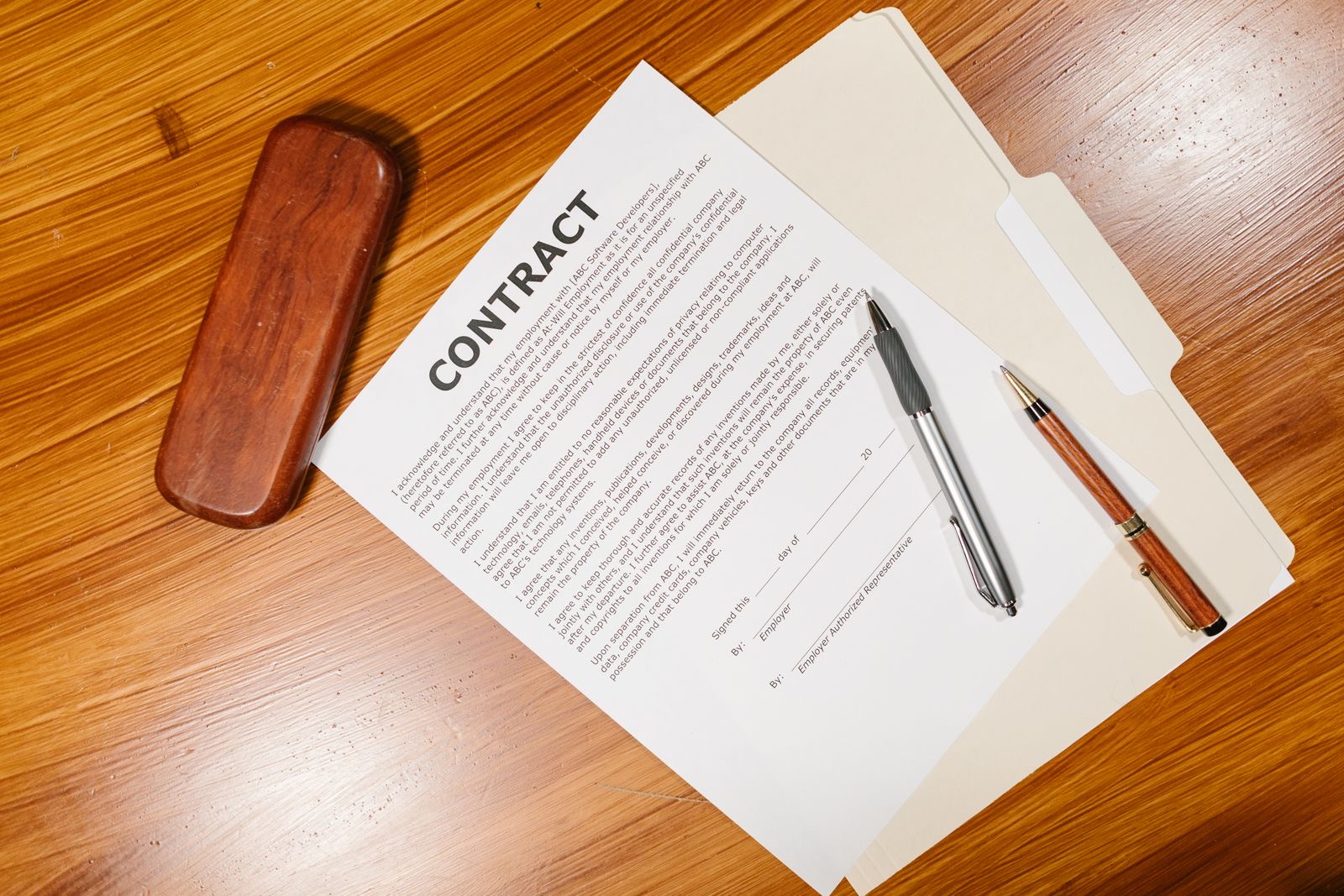 Papers being signed across a desk in a civil-law notary's office.